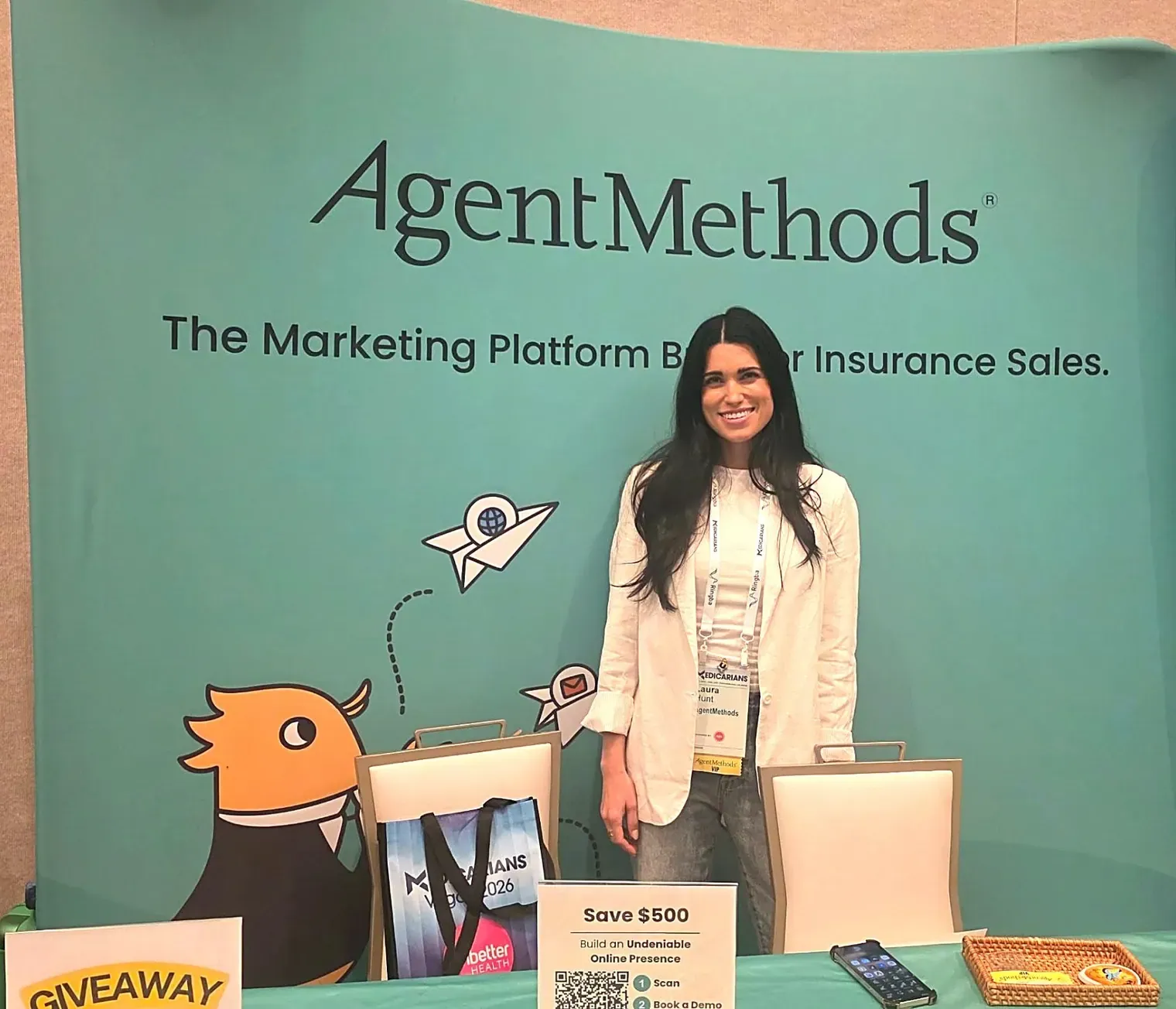 An AgentMethods team member at the company's booth at an agent conference